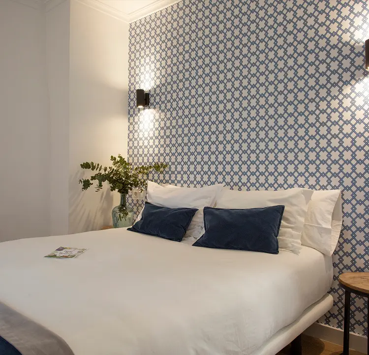 habitacion-home Cama de habitación del Hostal Savoy
